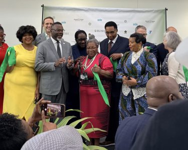 Mayor Johnson (left-center) joins The Community Builders and partners for the Sankofa Village Wellness Center ribbon cutting in West Garfield Park.