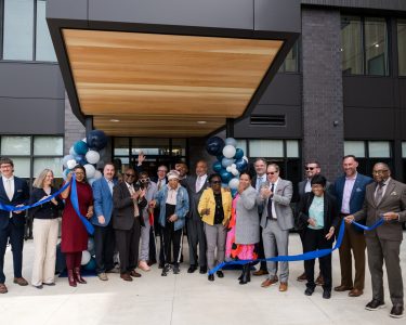 City of Cleveland, CHMA, TCB and community leaders join residents for the ribbon cutting at Woodhill Station East.