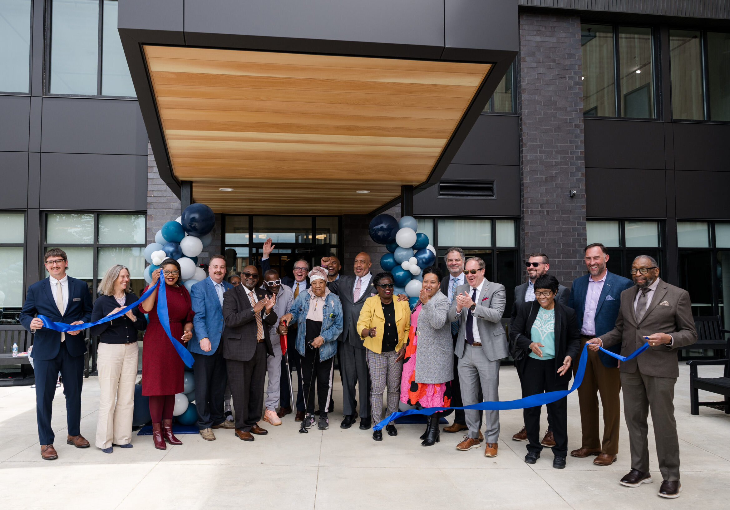City of Cleveland, CHMA, TCB and community leaders join residents for the ribbon cutting at Woodhill Station East.